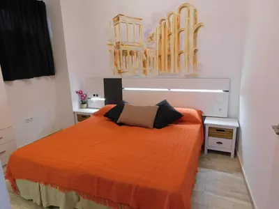 Cama o camas de una habitación en APARTAMENTO ROMULO Y REMO-ROMULO