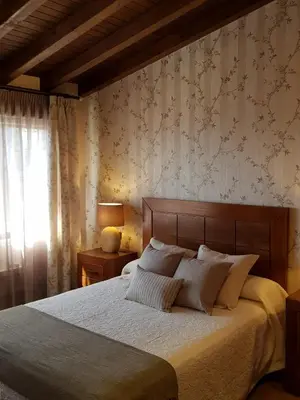 Cama o camas de una habitación en CASA RURAL VERSOS