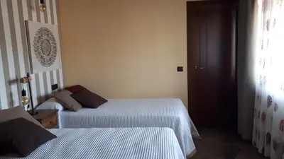 Cama o camas de una habitación en CASA RURAL VERSOS