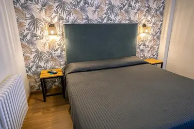 Cama o camas de una habitación en Complejo Roma