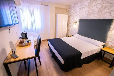 Cama o camas de una habitación en Complejo Roma