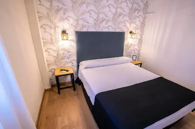 Cama o camas de una habitación en Complejo Roma