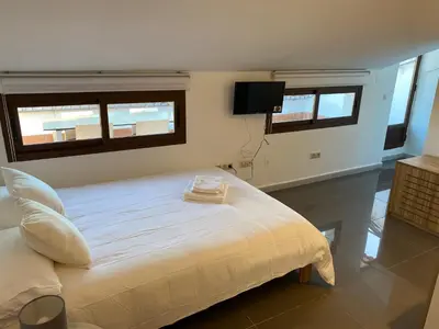 Cama o camas de una habitación en APARTAMENTOS FUENTE ARRIBA