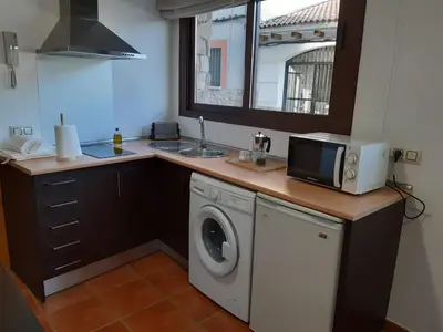 Una cocina o zona de cocina en APARTAMENTOS FUENTE ARRIBA