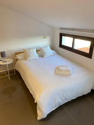 Cama o camas de una habitación en APARTAMENTOS FUENTE ARRIBA