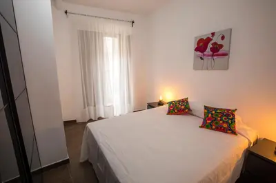 Cama o camas de una habitación en Apartamentos Cáceres Turístico