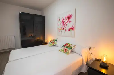 Cama o camas de una habitación en Apartamentos Cáceres Turístico