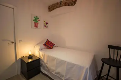 Cama o camas de una habitación en Apartamentos Cáceres Turístico