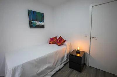 Cama o camas de una habitación en Apartamentos Cáceres Turístico