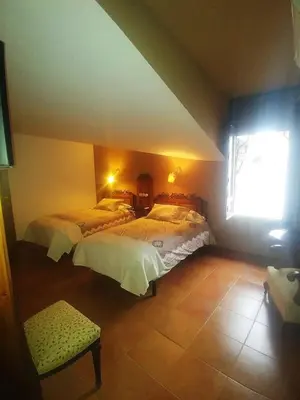 Cama o camas de una habitación en La Troje Oropesana