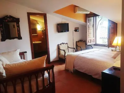 Cama o camas de una habitación en La Troje Oropesana