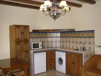Una cocina o zona de cocina en Apartamentos Los Hebiles