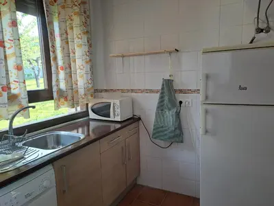 Una cocina o zona de cocina en Apartamentos La Eliza