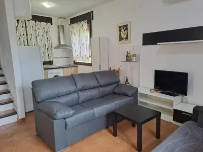 Una televisión o centro de entretenimiento en Apartamentos La Eliza