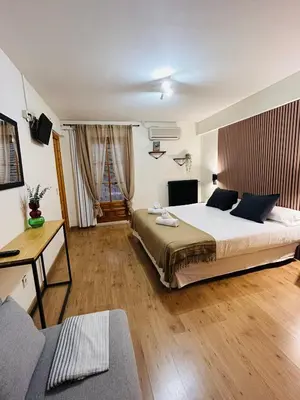 Cama o camas de una habitación en Hostal La Colonial