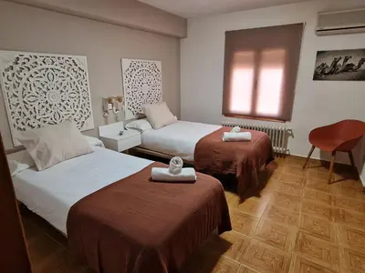 Cama o camas de una habitación en Hostal La Colonial