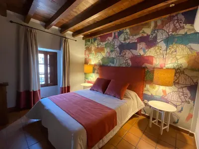 Cama o camas de una habitación en Posada Albarea