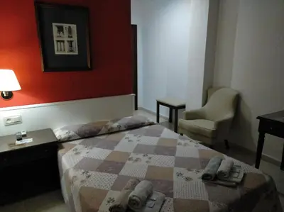 Cama o camas de una habitación en Hotel Nuevo Ara