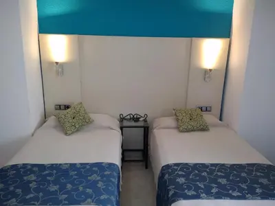 Cama o camas de una habitación en Hotel Nuevo Ara
