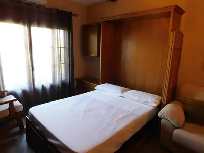Cama o camas de una habitación en El pequeño capricho