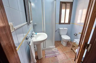 Un baño de Apartamentos Rurales El Solitario