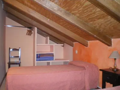 Cama o camas de una habitación en Núcleo de Turismo Rural Valle de Iruelas