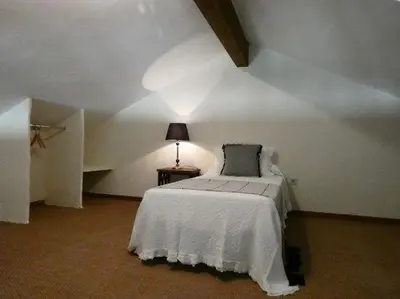 Cama o camas de una habitación en Núcleo de Turismo Rural Valle de Iruelas