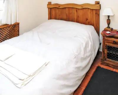 Cama o camas de una habitación en Welcoming house in Ávila with private parking