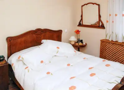 Cama o camas de una habitación en Welcoming house in Ávila with private parking