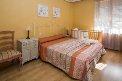 Cama o camas de una habitación en Apartamentos turisticos Avila Villa Carmen III