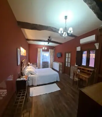Cama o camas de una habitación en Posada Real Ruralmusical