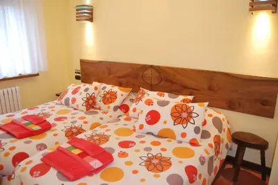 Cama o camas de una habitación en Casa Rural La Cuadraá