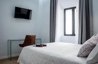 Cama o camas de una habitación en Apartamentos Turísticos Moret 11 - 1C