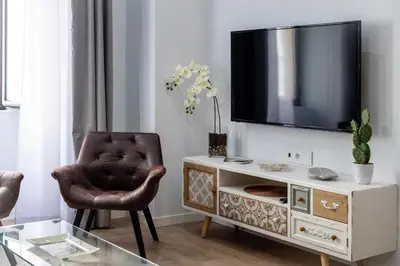 Una televisión o centro de entretenimiento en Apartamentos Turísticos Moret 11 - 1C