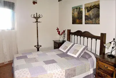 Cama o camas de una habitación en Casa rural LA DEHESA