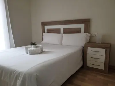Cama o camas de una habitación en Apartamento Turistico Puente Romano P3 BAJO - B