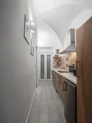 Una cocina o zona de cocina en Apartamentos Gladiador