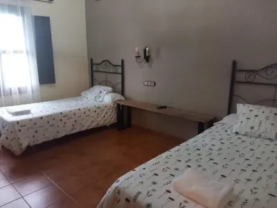 Cama o camas de una habitación en complejo rural el prado