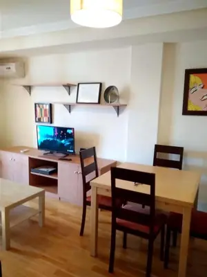 Una televisión o centro de entretenimiento en Modern apartment in Salamanca, 50 m², air-conditioned