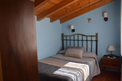 Cama o camas de una habitación en Casa Rural Abuelo Adón