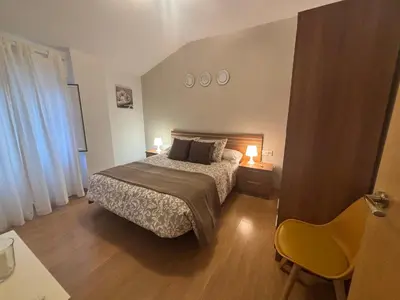 Cama o camas de una habitación en Apartamentos Turísticos Clavero 1
