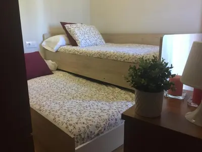 Cama o camas de una habitación en Apartamentos Turísticos Clavero 1