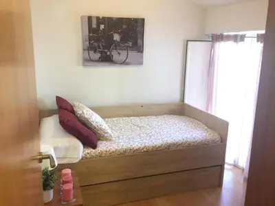 Cama o camas de una habitación en Apartamentos Turísticos Clavero 1