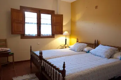 Cama o camas de una habitación en Charming House in Robledillo de Gata with Fireplace and Terrace
