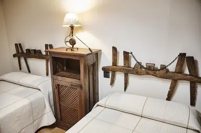 Cama o camas de una habitación en Casa Rural El Cantueso