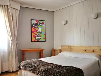 Cama o camas de una habitación en Hostal Alcántara