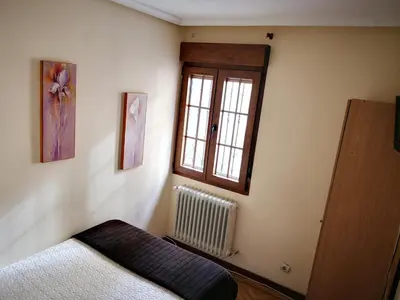 Cama o camas de una habitación en Hostal Alcántara