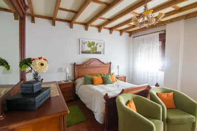 Cama o camas de una habitación en Apartamentos Rurales El Prado
