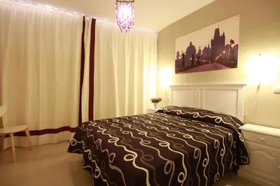 Cama o camas de una habitación en Apartamentos El Templo Suites