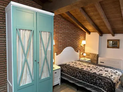 Cama o camas de una habitación en Apartamentos A Fala en Trevejo y San Martin de Trevejo, Sierra de Gata